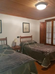 Rúm í herbergi á Casa Simón