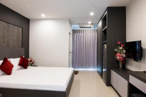 เตียงในห้องที่ DB Plus 5