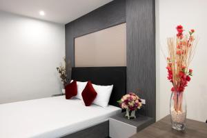 เตียงในห้องที่ DB Plus 5