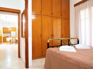 A bed or beds in a room at Traditional Cretan Villa