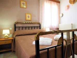 A bed or beds in a room at Traditional Cretan Villa