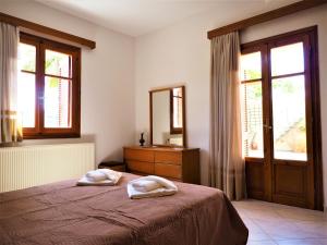 A bed or beds in a room at Traditional Cretan Villa