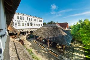 an overhead view of a building with a straw roof at Hotel Slamený dom in Košice