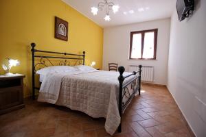 Un pat sau paturi într-o cameră la Il Podere di Francesco