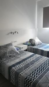 A bed or beds in a room at casa quintana