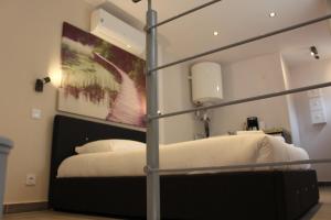 Postel nebo postele na pokoji v ubytování Residence Villa Ange