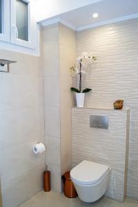 Et badeværelse på Melody Apartments