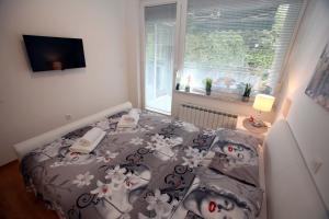 Postel nebo postele na pokoji v ubytování Apartment West