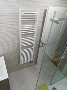 a bathroom with a shower and a glass door at Apartments Justin in Bled +34 photos