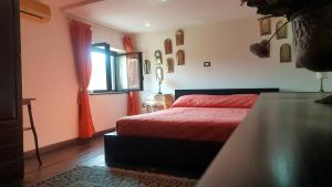 Posteľ alebo postele v izbe v ubytovaní B&B La Mimosa