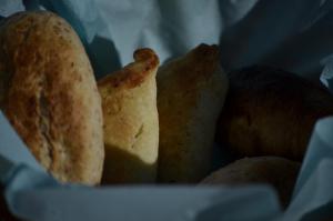 a basket filled with bread and other food items at Lindos Esel Suites in Lindos