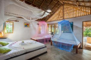 Postel nebo postele na pokoji v ubytování De Silva Wind Resort Kalpitiya - Kitesurfing School Sri Lanka + 37 fotografií