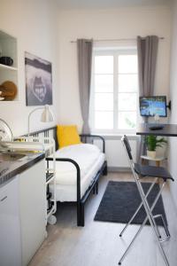 A kitchen or kitchenette at Rába Apartman House