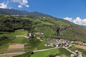 an aerial view of a village on a mountain at Hofer Hof in Feldthurns +23 photos