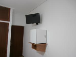 a flat screen tv on a wall in a room at Hotel Aris in Methoni