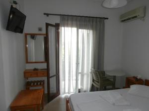 Voodi või voodid majutusasutuse Hotel Aris toas