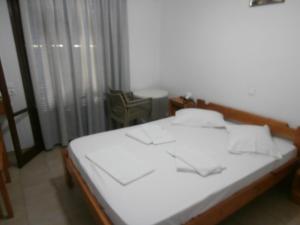 Voodi või voodid majutusasutuse Hotel Aris toas