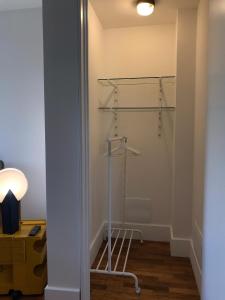 a room with a walk in closet with a shelf at Villa vicino Napoli in Pollena Trocchia +10 photos