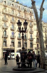 a street light in front of a large building at Hotel Toledano Ramblas in Barcelona