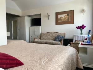 Säng eller sängar i ett rum på Hotel Wenus