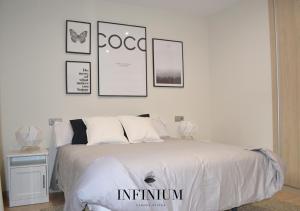 Postel nebo postele na pokoji v ubytování Infinium Zamora Suites