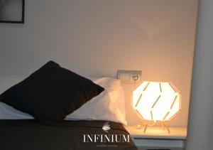 Postel nebo postele na pokoji v ubytování Infinium Zamora Suites