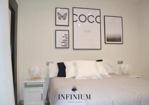 Postel nebo postele na pokoji v ubytování Infinium Zamora Suites