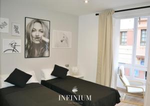 Postel nebo postele na pokoji v ubytování Infinium Zamora Suites