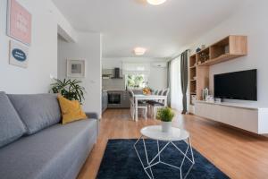 a living room with a couch and a table at Villa Carmela in Labin