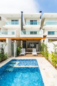 an image of a villa with a swimming pool at Villaggio Juquehy in Juquei