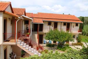 an image of a house with red tile roofs at Romeo & Juliet in Perivolion