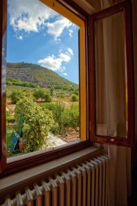 a window with a view of a mountain at B&B Via della Grotta in Monsummano