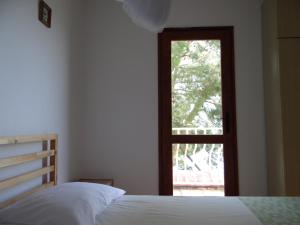 Postel nebo postele na pokoji v ubytování Apartments Bassi