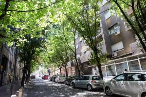 a street with cars parked on the side of the road at City Holliday Lux in Belgrade