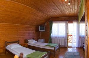 Postel nebo postele na pokoji v ubytování Pensiunea Moldovan