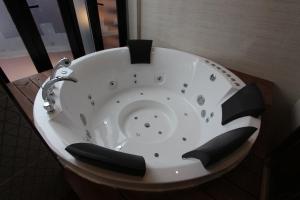 a bath tub with a teddy bear in the middle at Instar Tourist Hotel in Daegu