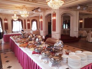 a long table with food on it in a room at Continental Hotel in Ulaanbaatar +37 photos