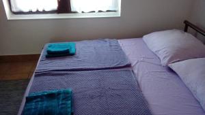 Posteľ alebo postele v izbe v ubytovaní Apartmani ZP44