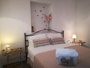 A bed or beds in a room at Maison MilleOttocento