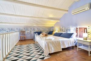 Villa Giannina tesisinde bir odada yatak veya yataklar