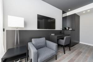 Televízia a/alebo spoločenská miestnosť v ubytovaní Artis accommodation