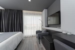 Televízia a/alebo spoločenská miestnosť v ubytovaní Artis accommodation