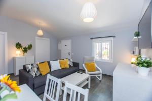 a living room with a couch and a table at Casa Alma in Marbella