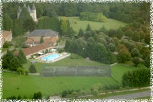 an aerial view of a house with a swimming pool at Hôtellerie de Plein Air Camping Leychoisier in Bonnac-la-Côte +9 photos