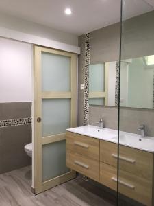 a bathroom with two sinks and a toilet at Clos Des Plages Maison De Vacances in La Ciotat +72 photos