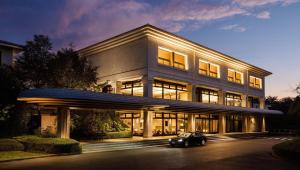 a building with a car parked in front of it at Izu Marriott Hotel Shuzenji in Izu