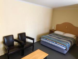 Postel nebo postele na pokoji v ubytování Sheffield Motor Inn