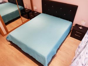 Кровать или кровати в номере Apartamento Portimão
