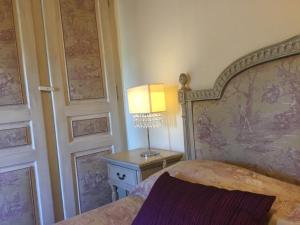 Cama o camas de una habitación en Chambre d'hôtes Au Chant des Sorgues
