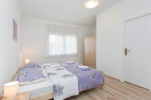 A bed or beds in a room at Brankica apartaments